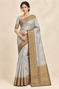 Model in silver grey saree wearing a layered gold chain necklace